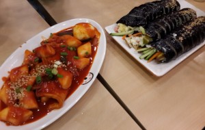korean sushi roll called kimbap and another tteokbokki